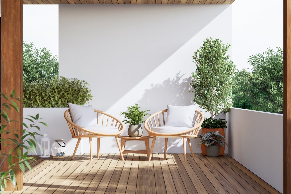 Modern contemporary terrace with natural wood and plants connecting to the outdoors