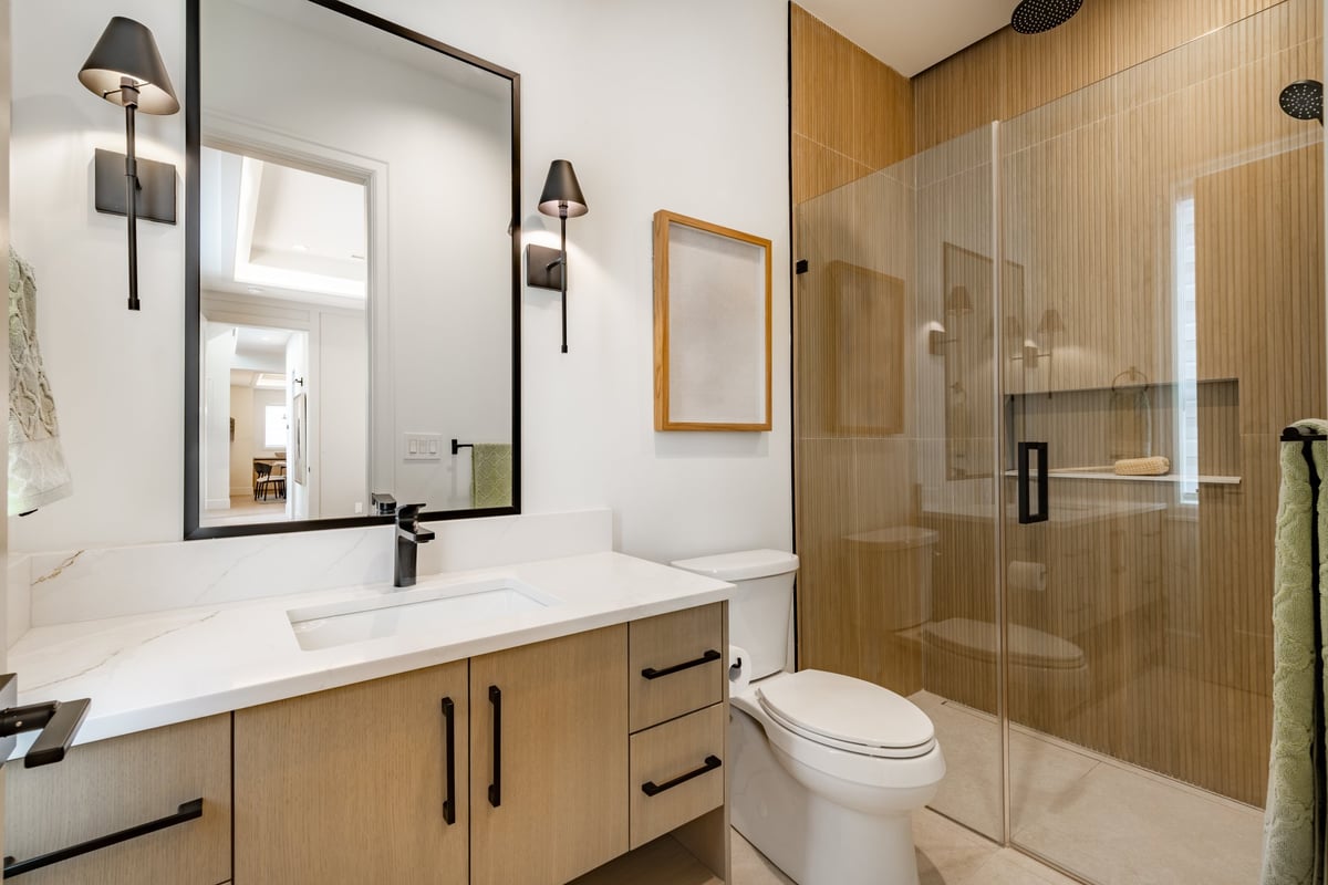 Modern luxury bathroom renovation with walk-in shower and marble finishes in Chilliwack