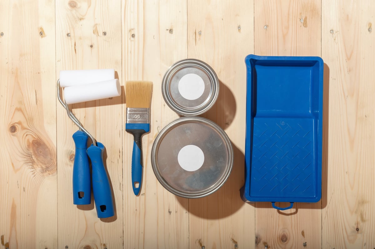 Professional renovation tools and equipment properly organized on wooden floor