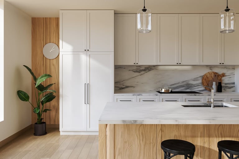 Modern kitchen renovation with marble countertops and white cabinets