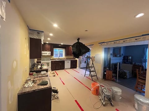 Chilliwack kitchen renovation project in progress featuring custom cabinets, floor protection and professional construction equipment