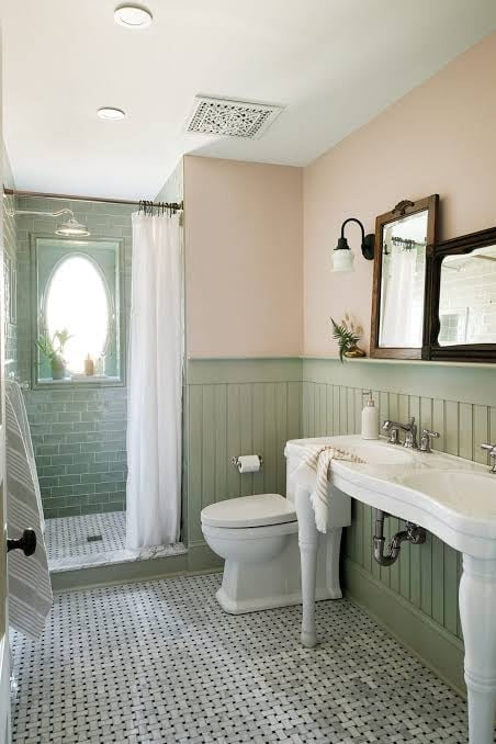 Cottage-style bathroom with mint green wainscoting and pedestal sink