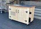 Custom storage solutions built by our Chilliwack handyman team featuring cream-colored wooden enclosed box with two doors
