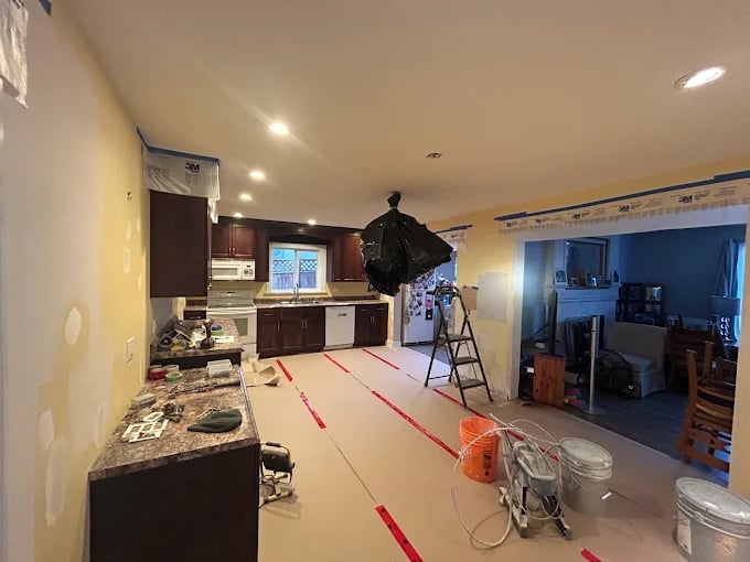 Kitchen renovation completed by our Chilliwack handyman with modern dark cabinets and professional finish